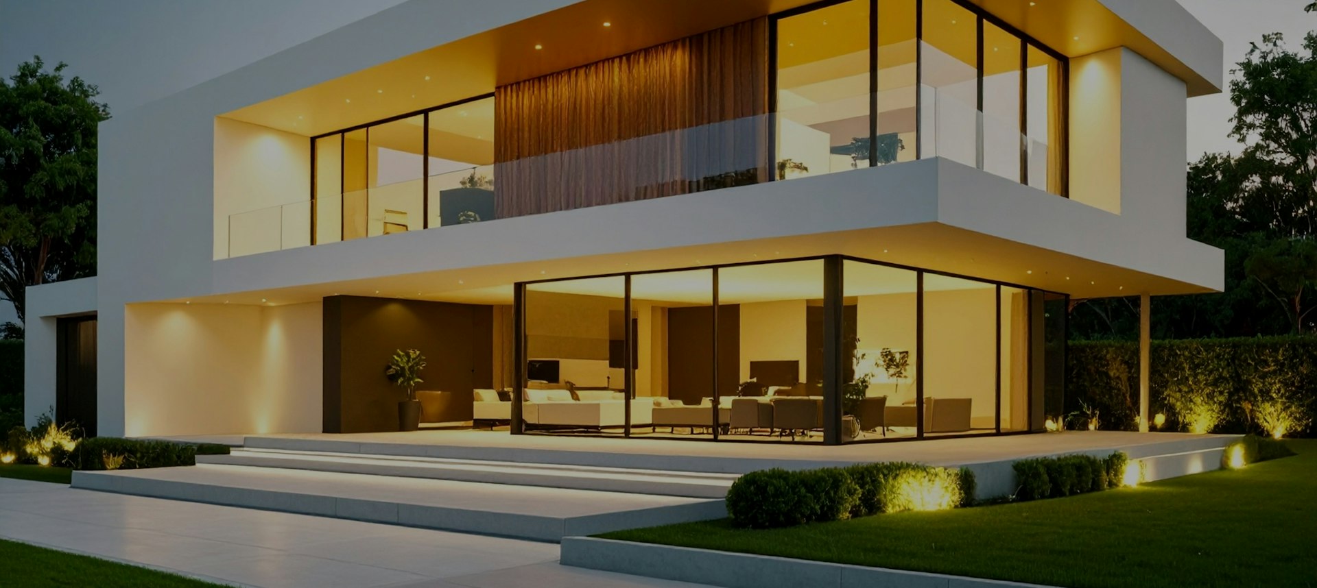 Residência contemporânea de linhas retas iluminada ao entardecer